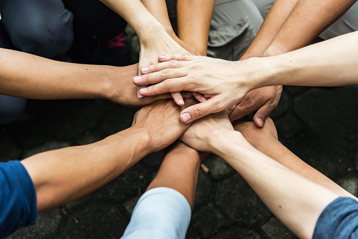 Group of people United Hands to built teamwork together with Spi